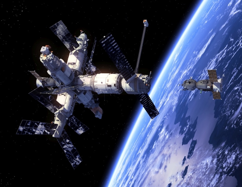 Spacecraft "Soyuz" And Space Station. 3D Scene.